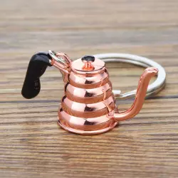 Růžová konvice přívěsek na klíče od značky Coffea je skvělým dárkem pro milovníky kávy, který přinese radost každému, kdo ocení stylové doplňky.