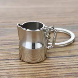 Přívěsek na klíče ve tvaru stříbrné konvičky na mléko od značky Coffea je ideálním dárkem pro milovníky kávy.